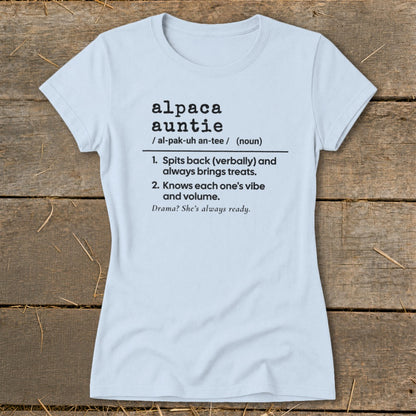 Light blue t-shirt with "alpaca auntie" definition and descriptive phrases.