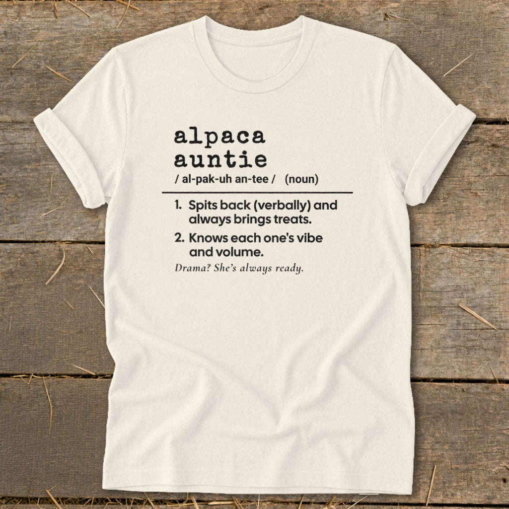 Cream t-shirt with black text defining "alpaca auntie".