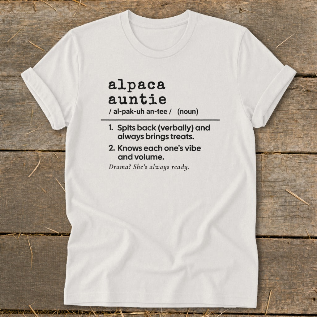 White t-shirt with "alpaca auntie" definition: spits back, brings treats, knows vibes, ready for drama.