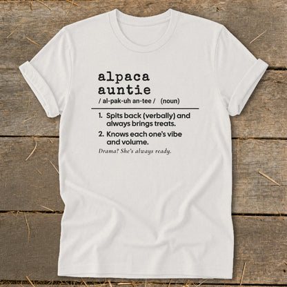 White t-shirt with "alpaca auntie" definition: spits back, brings treats, knows vibes, ready for drama.