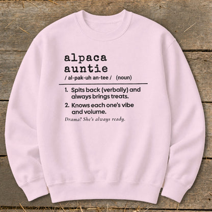 Light pink sweatshirt with "Alpaca Auntie" definition printed in black text.