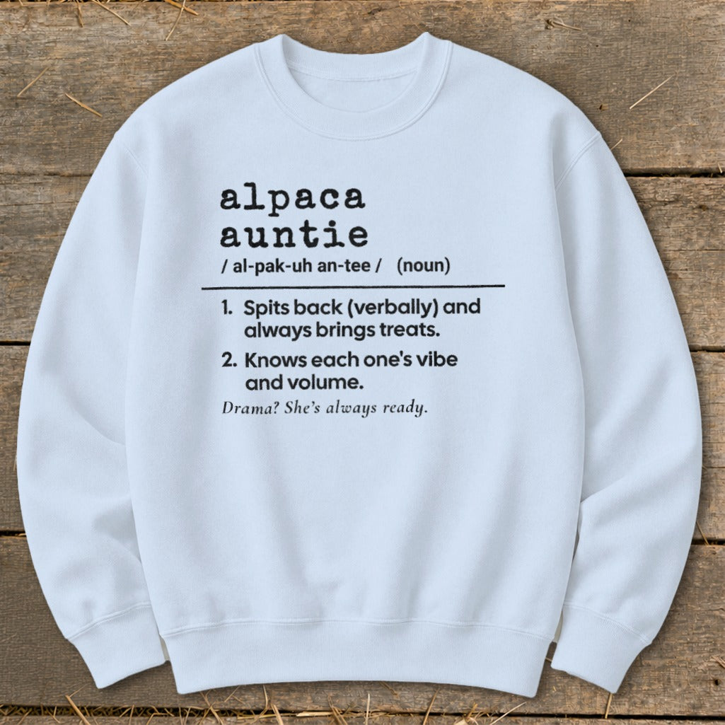 White sweatshirt with "Alpaca Auntie" definition: spits back, brings treats, knows vibe, ready for drama.