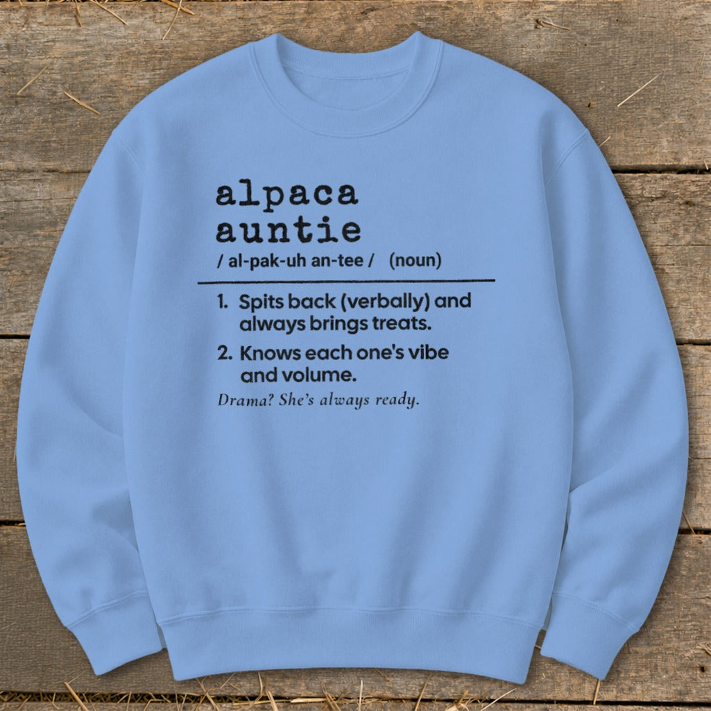Light blue crewneck sweatshirt with "alpaca auntie" dictionary definition.