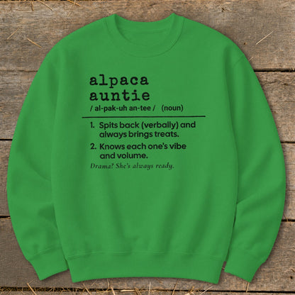 Green sweatshirt with "alpaca auntie" definition including pronunciation and two descriptive phrases.