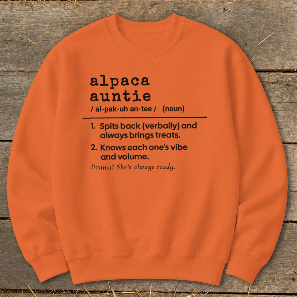 Orange crewneck sweatshirt with "Alpaca Auntie" definition in black text.