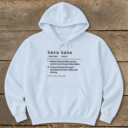 White hoodie with "barn babe" definition: wears flannel, rocks muck boots, found where hay's stacked.