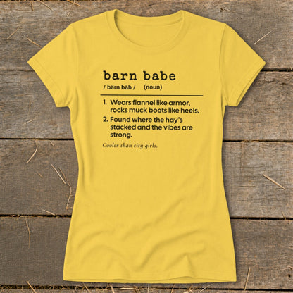 Yellow t-shirt with black text defining "barn babe" and its characteristics.