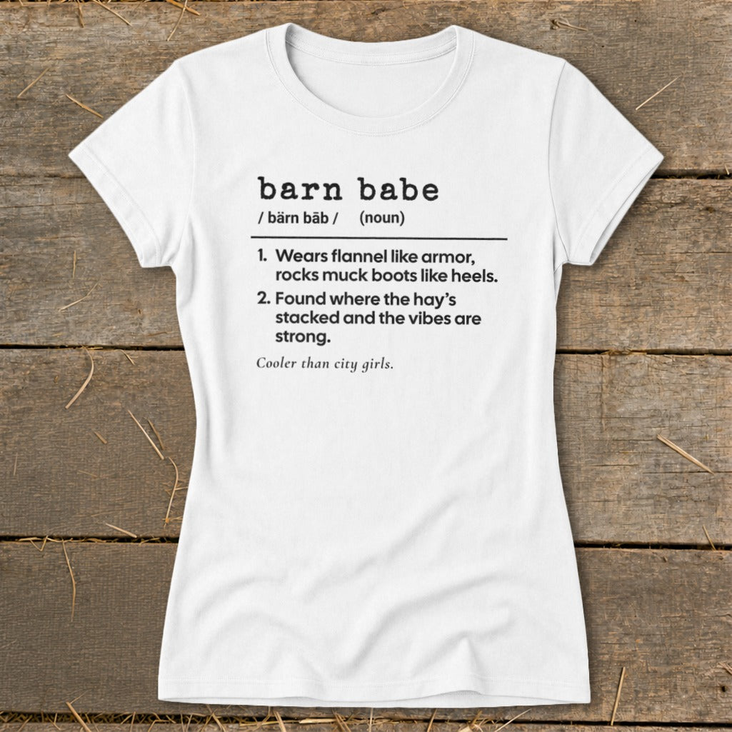 White t-shirt with "barn babe" definition: "Wears flannel, rocks muck boots. Found where hay's stacked."