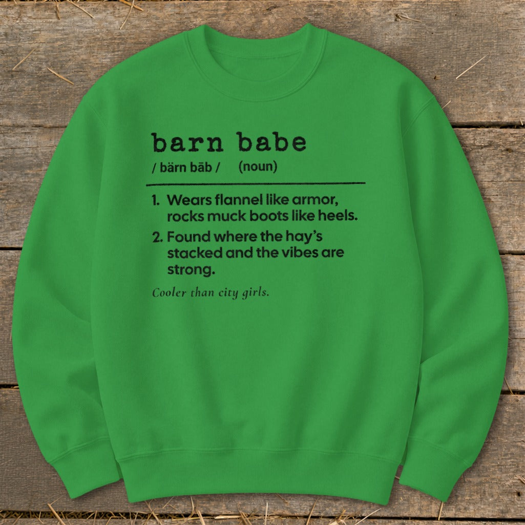 Green sweatshirt with black text defining "barn babe" as someone who wears flannel and muck boots.