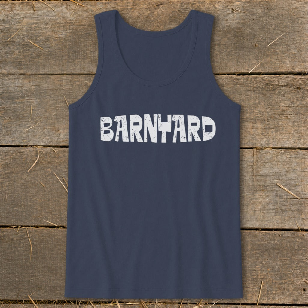 A dark blue tank top featuring the white distressed text BARNYARD laid flat on a rustic wooden surface.