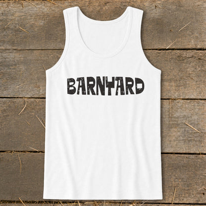 White tank top with the word "BARNYARD" printed in black, displayed flat on a wooden surface.