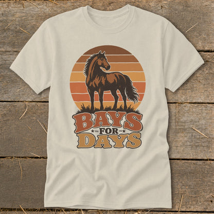 Beige t-shirt featuring a retro brown horse graphic and the text Bays for Days on a wooden background.