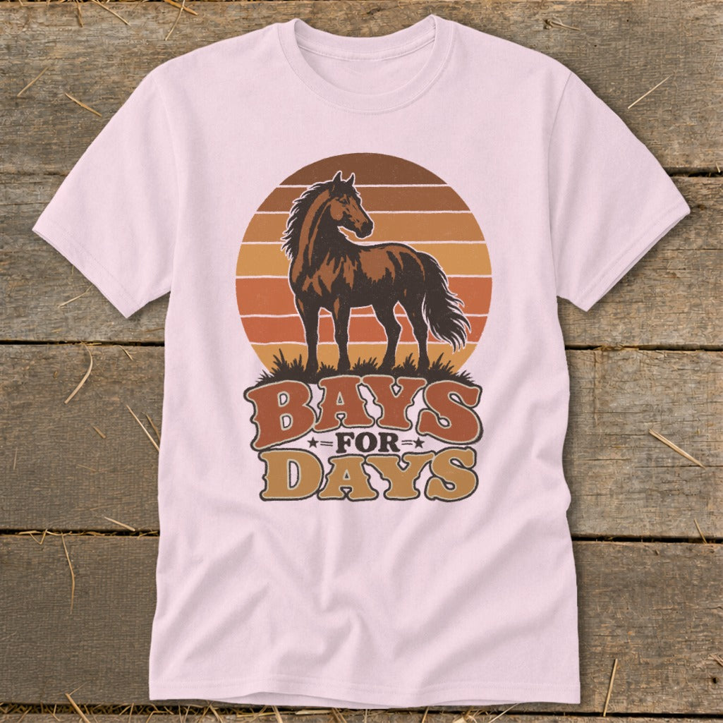 A light pink t-shirt featuring a brown horse graphic over a sunset and the text "BAYS FOR DAYS."
