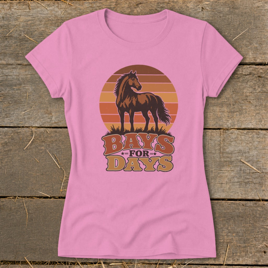 Pink women's t-shirt featuring a retro graphic of a brown horse and sunset with text reading Bays for Days.