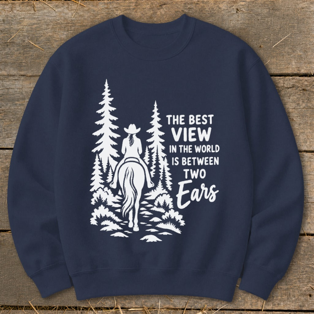Dark blue crewneck sweatshirt featuring a white graphic of a horseback rider amid pine trees with text.