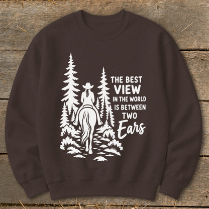 A dark brown sweatshirt printed with a white graphic of a horse rider in a forest and text.
