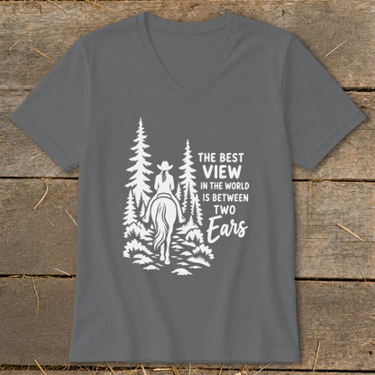 A dark gray V-neck t-shirt with a white graphic of a horseback rider and text reading The Best View In The World Is Between Two Ears.