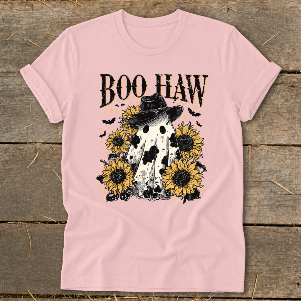 Pink t-shirt with "Boo Haw" text, a cow-print ghost wearing a cowboy hat, and sunflowers.