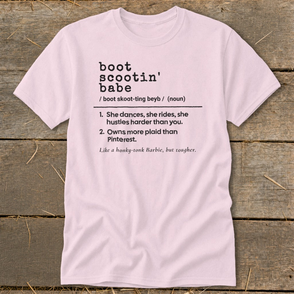 Pink t-shirt with "boot scootin' babe" definition printed on front.
