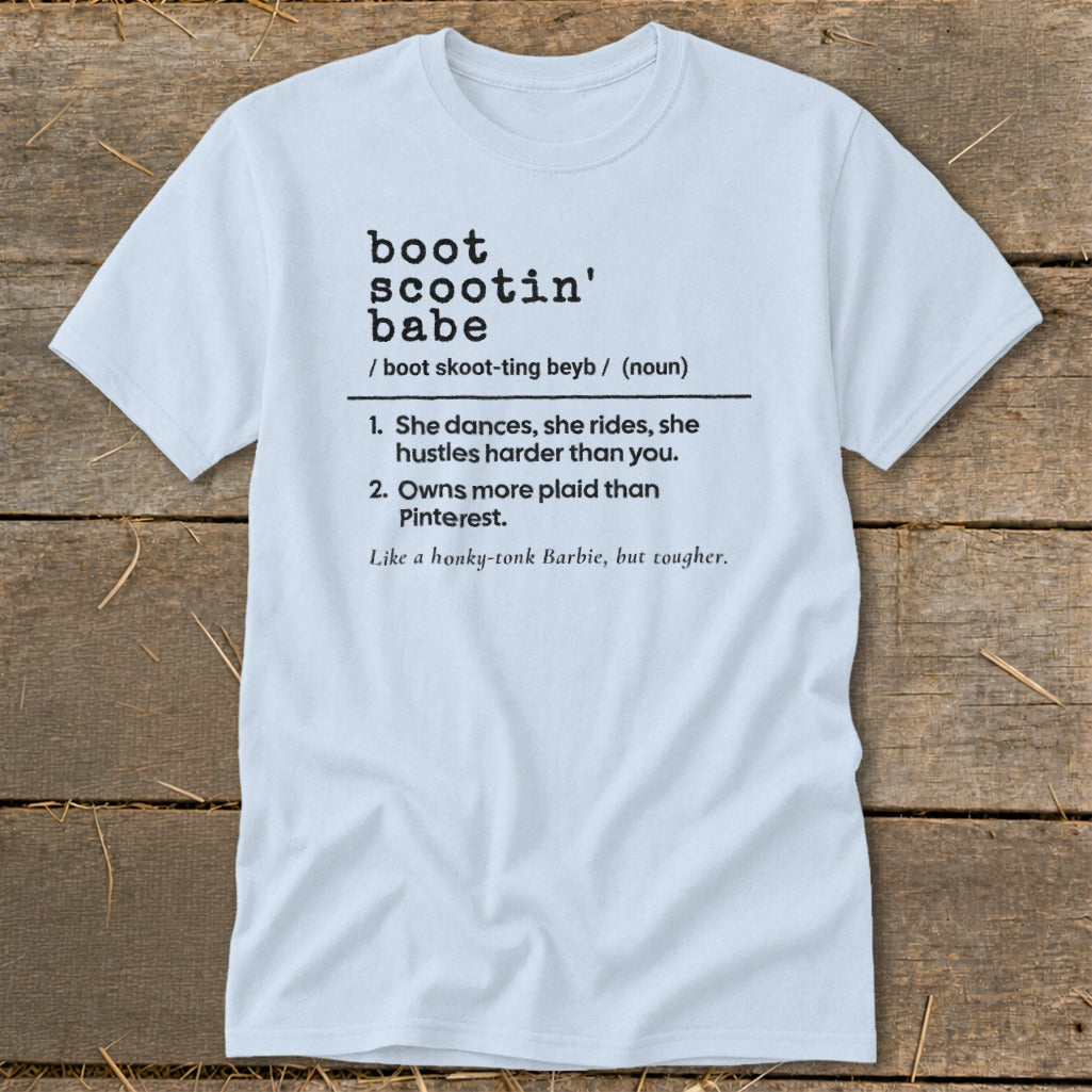 Light blue t-shirt with definition of "boot scootin' babe" in black text.