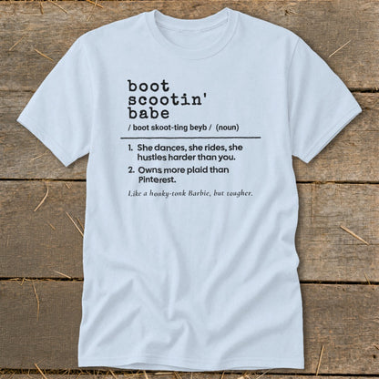 Light blue t-shirt with definition of "boot scootin' babe" in black text.