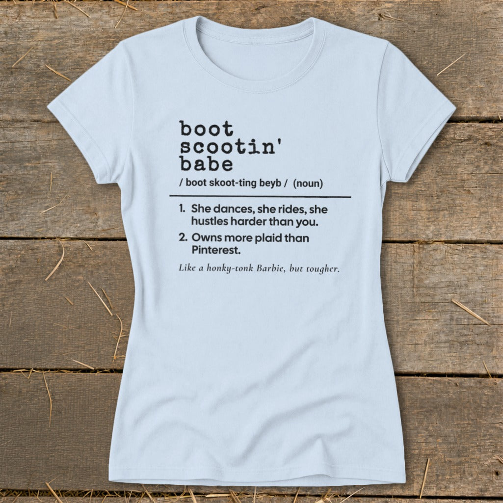 Light blue t-shirt with "boot scootin' babe" definition and humorous descriptions.