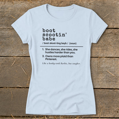 Light blue t-shirt with "boot scootin' babe" definition and humorous descriptions.