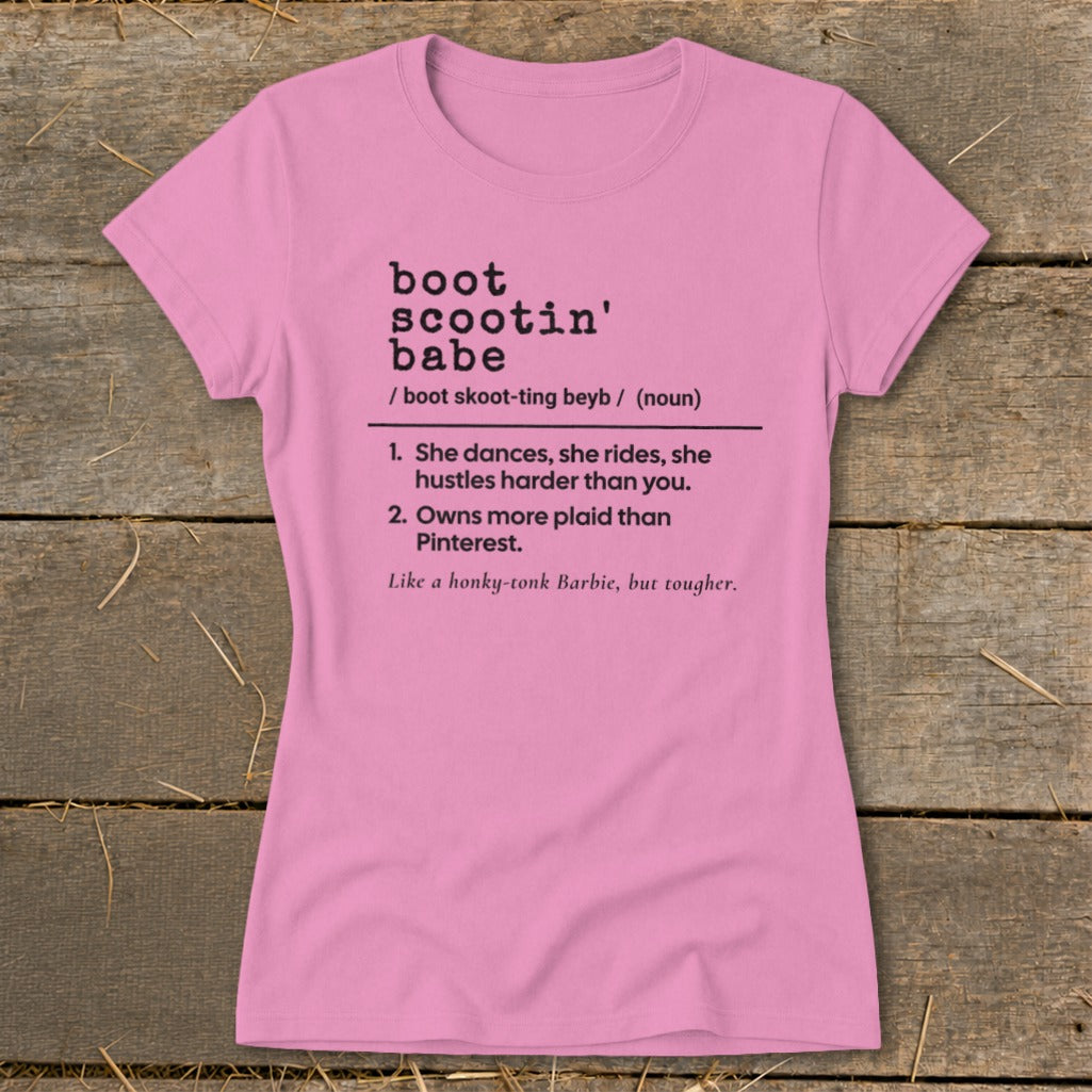 Pink t-shirt with black text defining "boot scootin' babe."