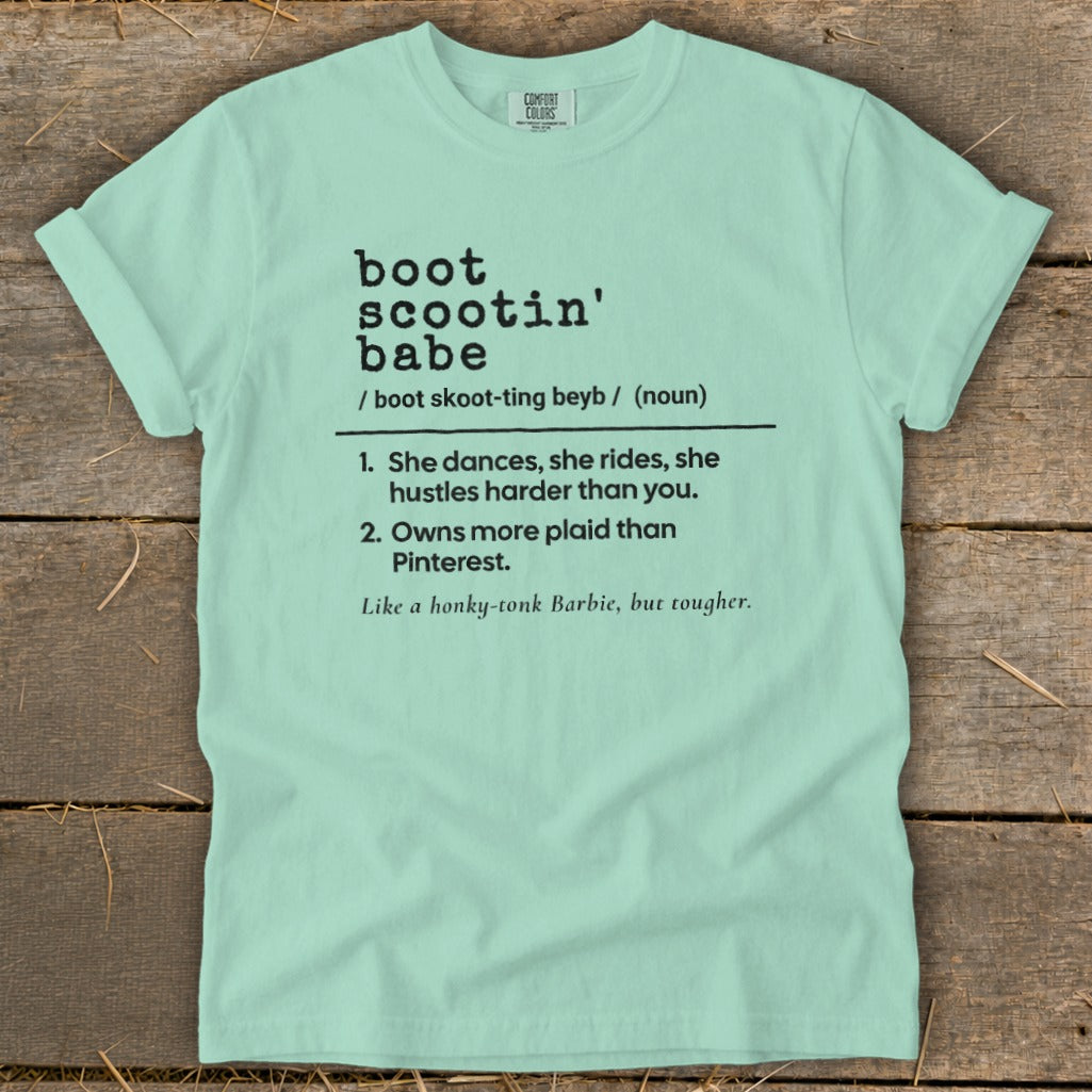 Mint green Comfort Colors t-shirt with "boot scootin' babe" definition.