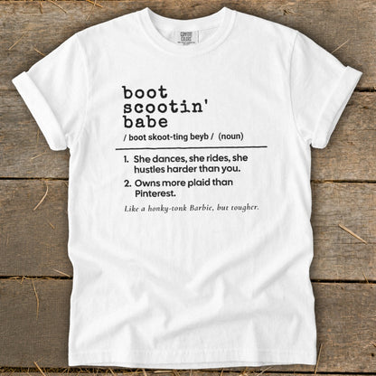White t-shirt with "boot scootin' babe" definition printed on it.