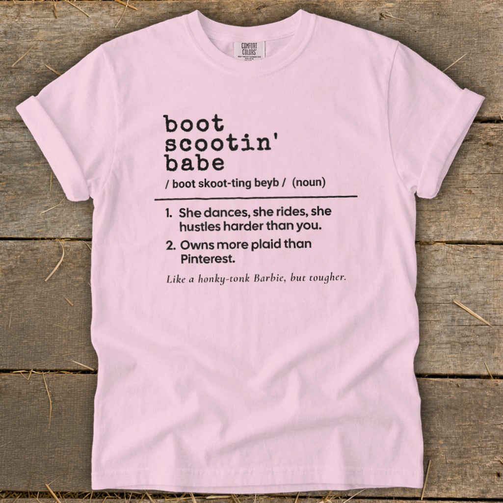 Pink t-shirt with "boot scootin' babe" definition.