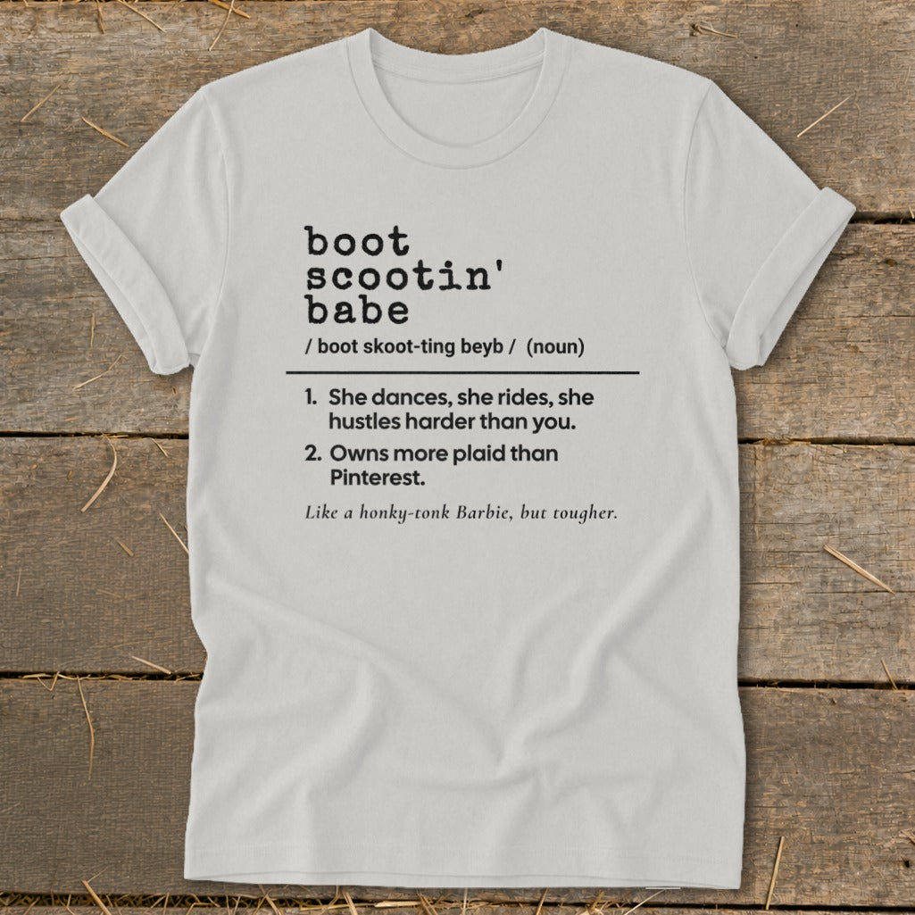 White t-shirt with "boot scootin' babe" definition and country-themed descriptions.