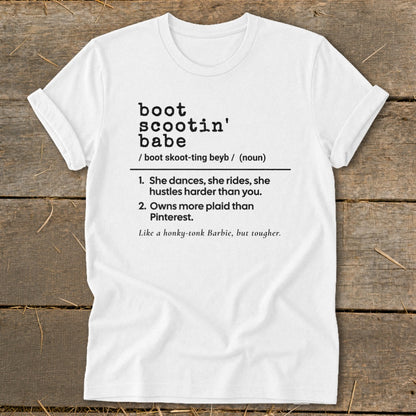 White t-shirt with "boot scootin' babe" definition and related phrases in black text.