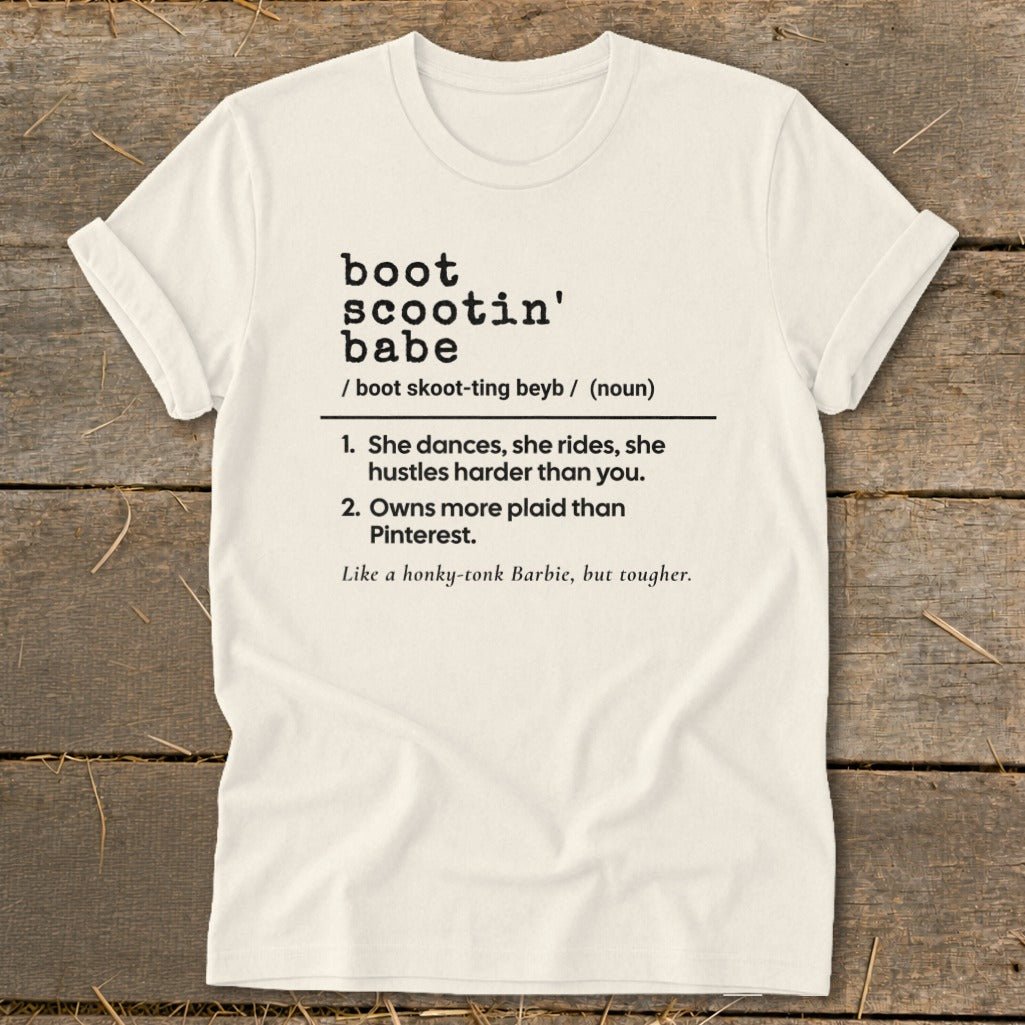 Cream t-shirt with "boot scootin' babe" definition and description.
