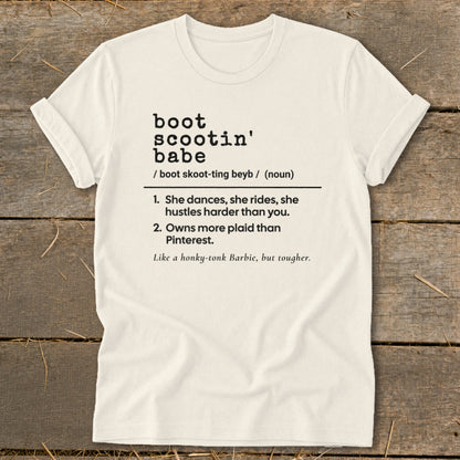 Cream t-shirt with "boot scootin' babe" definition and description.