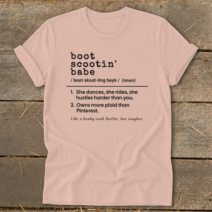 Pink t-shirt with "boot scootin' babe" definition in black text.