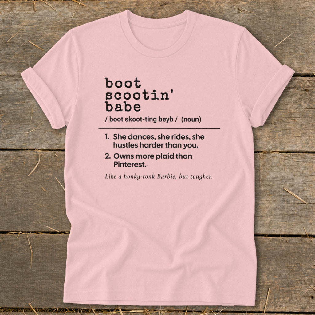 Pink t-shirt with "Boot Scootin' Babe" definition including sayings and pronunciation.