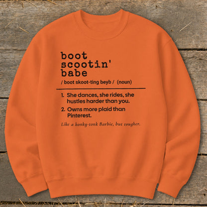 Orange sweatshirt with definition of "boot scootin' babe" and related phrases.