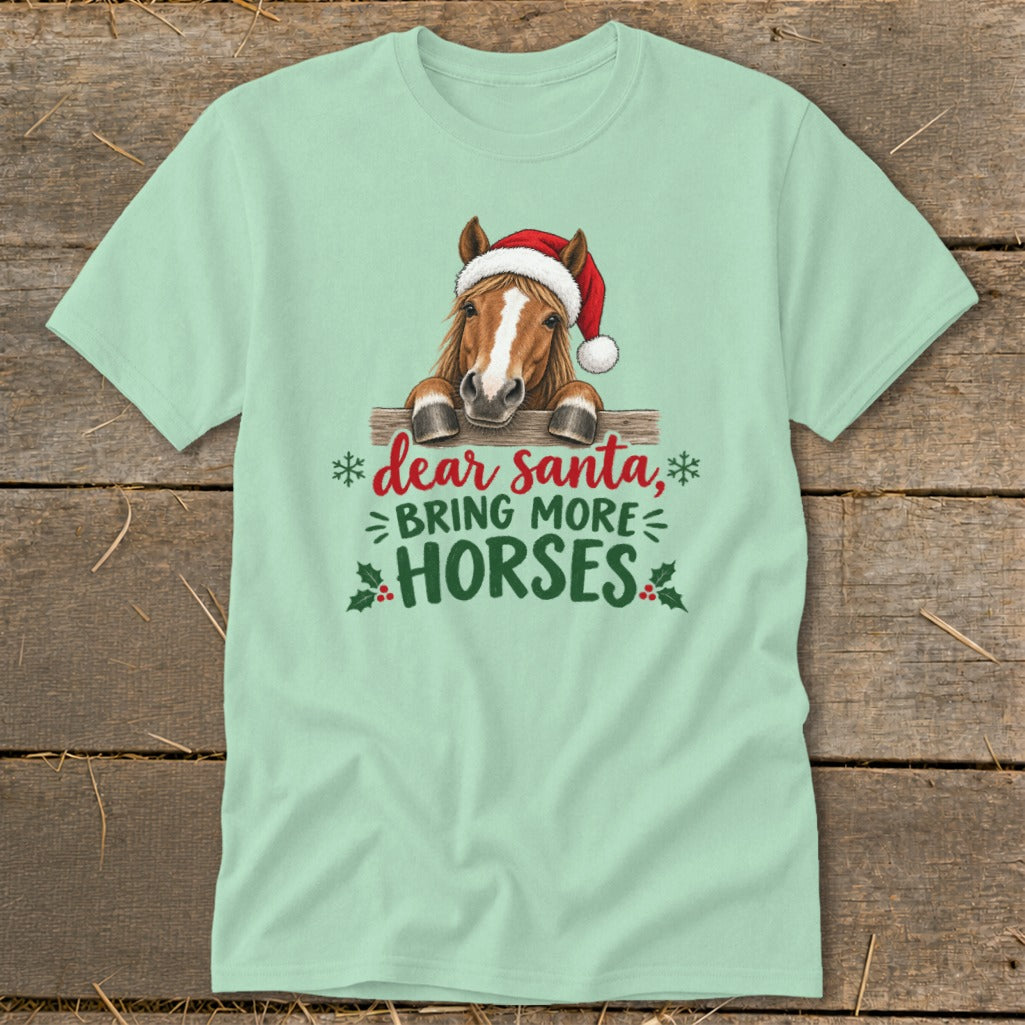 Mint green t-shirt featuring a horse wearing a Santa hat and the text dear santa, bring more horses.