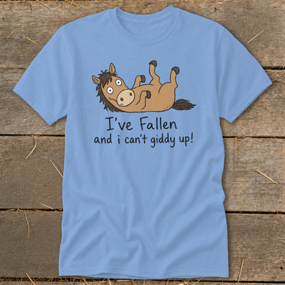 Light blue t-shirt with a cartoon horse lying on its back and text.