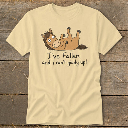 Light yellow t-shirt with cartoon horse and text "I've fallen and I can't giddy up!".