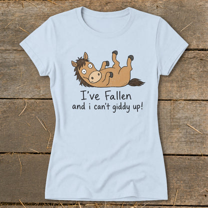 Light blue t-shirt with a cartoon horse lying on its back saying "I've fallen and I can't giddy up!".