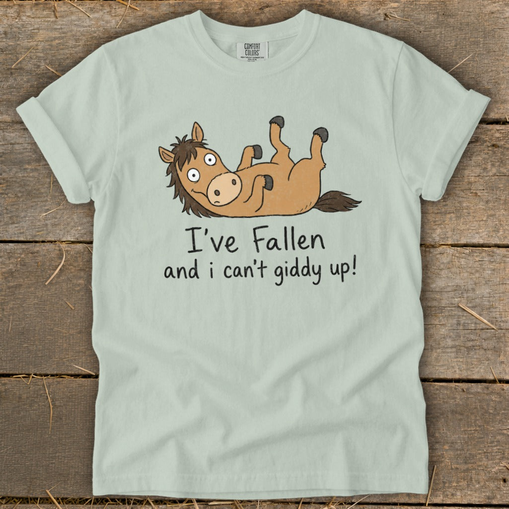 Light blue t-shirt with cartoon horse and text "I've Fallen and I can't giddy up!".