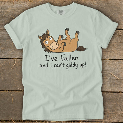 Light blue t-shirt with cartoon horse and text "I've Fallen and I can't giddy up!".