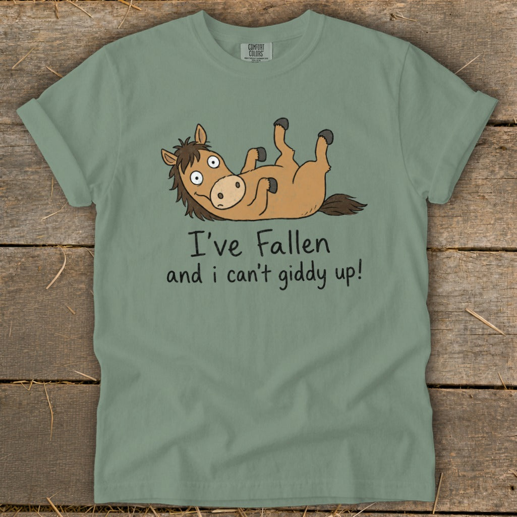 Sage green t-shirt with cartoon horse and text "I've Fallen and I can't giddy up!".