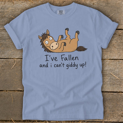 Light blue t-shirt with cartoon horse lying on its back with text "I've Fallen and I can't giddy up!"