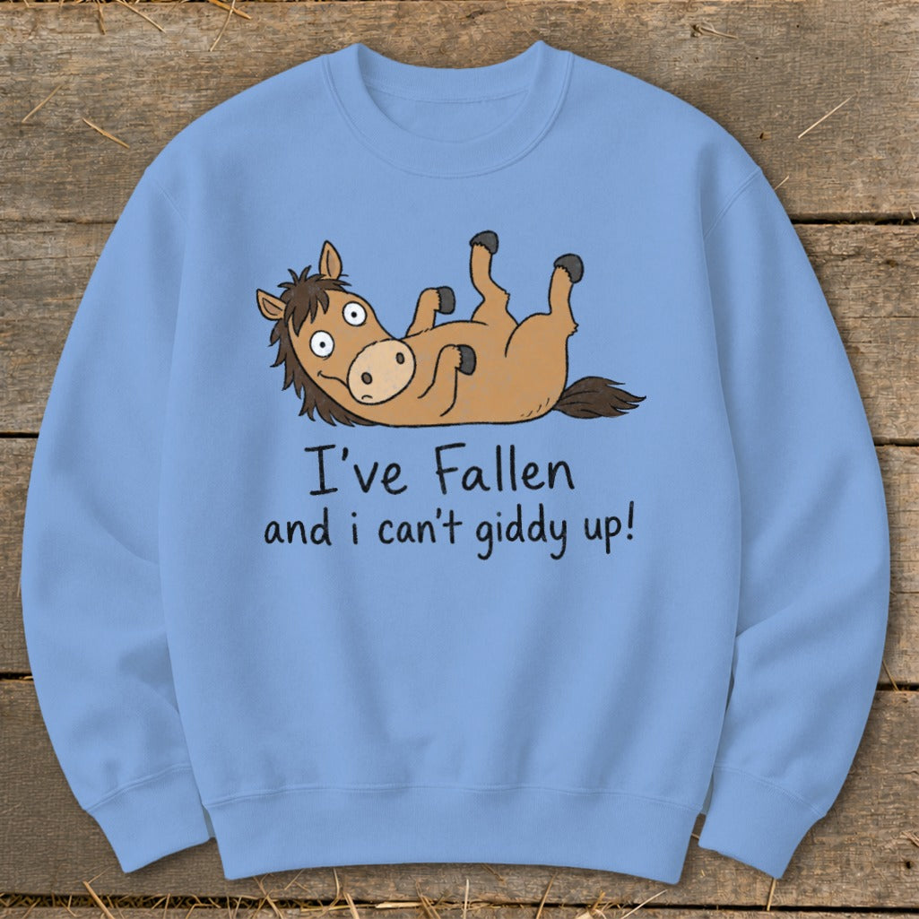 Light blue sweatshirt with a cartoon horse lying on its back, text "I've Fallen and I can't giddy up!".