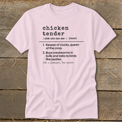 Light pink t-shirt featuring humorous dictionary definition text about chicken tenders printed on the front.