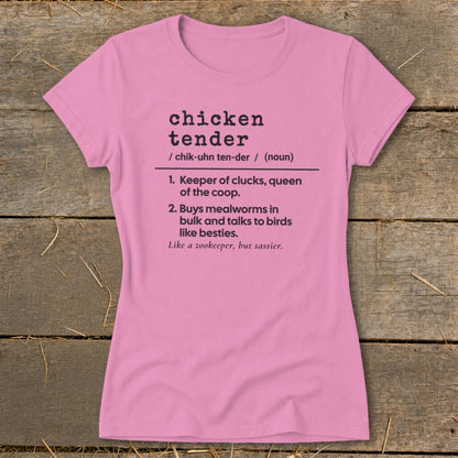 A pink short-sleeved t-shirt with a humorous definition of chicken tender printed in black.