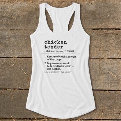 A white women's racerback tank top featuring a dictionary-style definition of "chicken tender" printed in black.